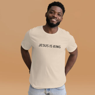 man with a cream colored t-shirt that says Jesus is King